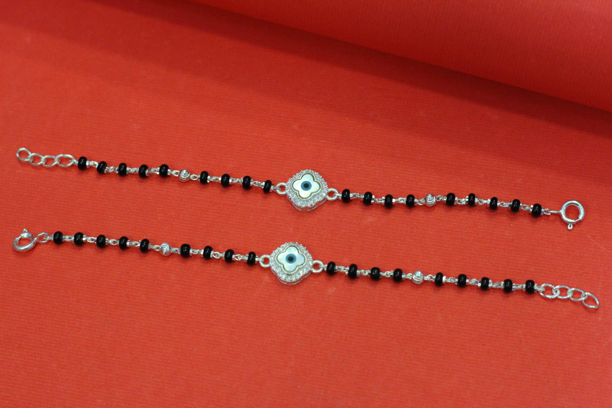 Silver nazariya with floral evil-eye centerpiece