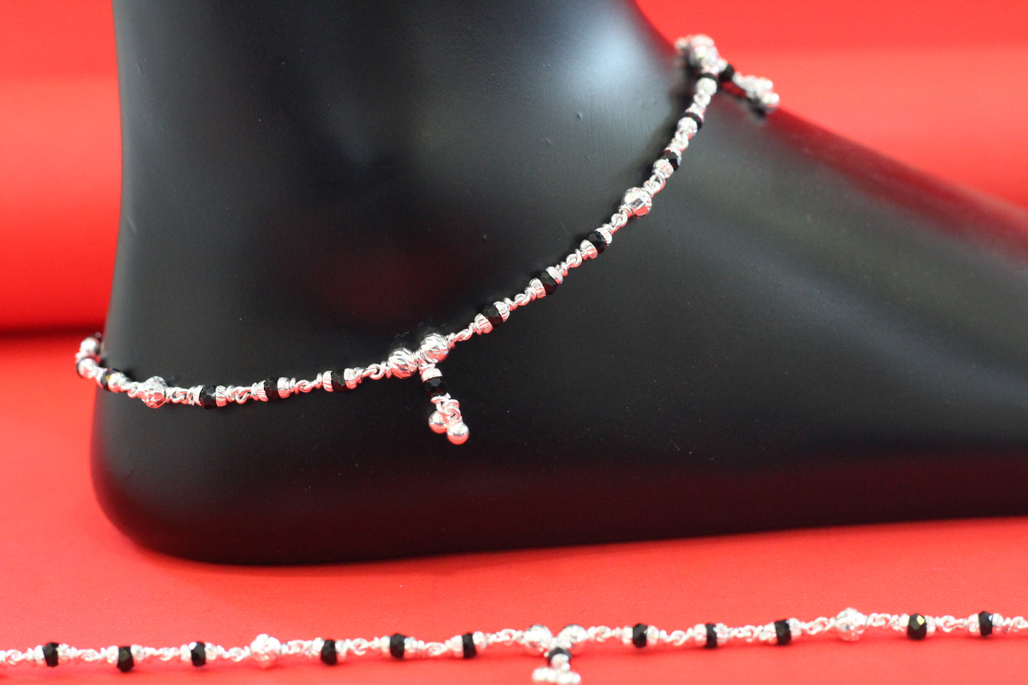 Lightweight silver anklet with small dangling beads for a graceful look