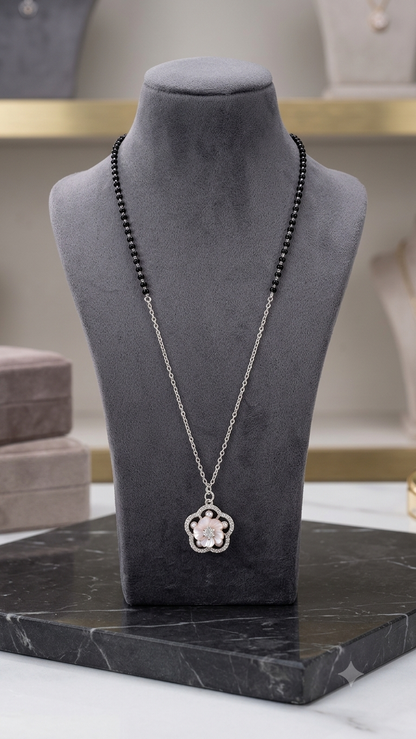 Silver Floral Modern Mangalsutra with matching earrings.