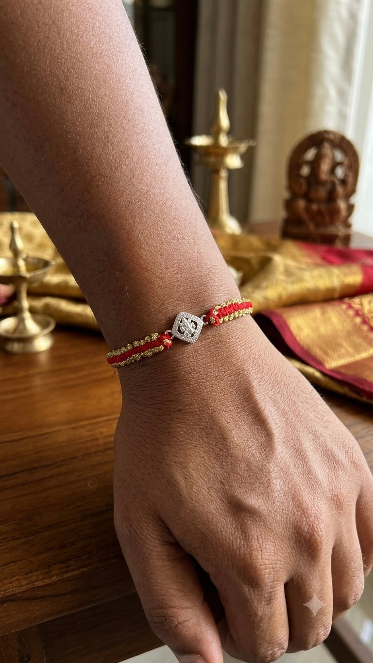 Silver ganesha Charm Red & Gold Braided Thread Rakhi