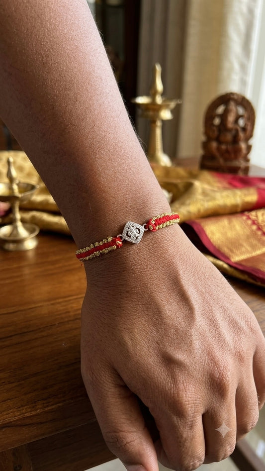 Silver ganesha Charm Red & Gold Braided Thread Rakhi