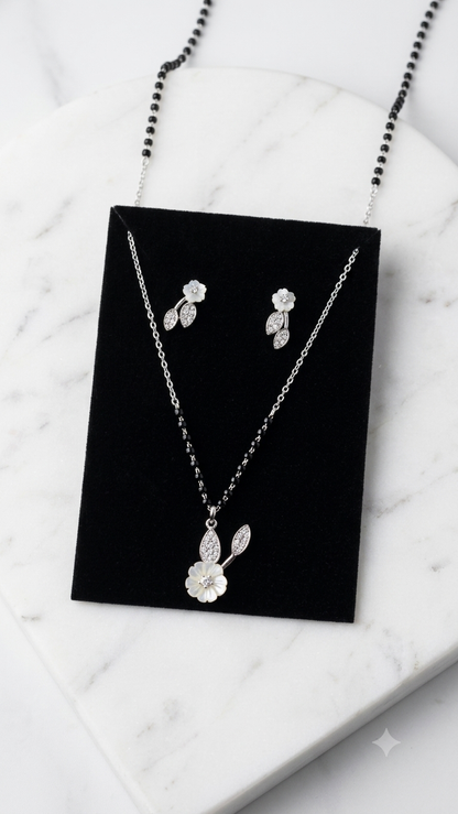 Silver Floral Modern Mangalsutra with matching earrings.
