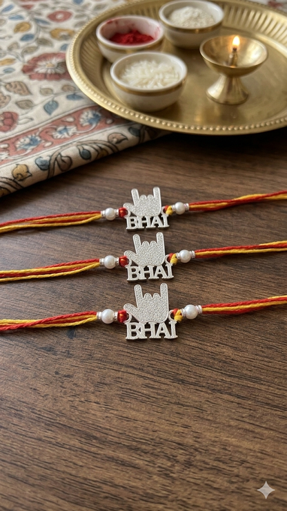 Silver "Bhai" Rock Sign Rakhi (Set of 3) – Sacred Mauli Thread with Pearl Accents