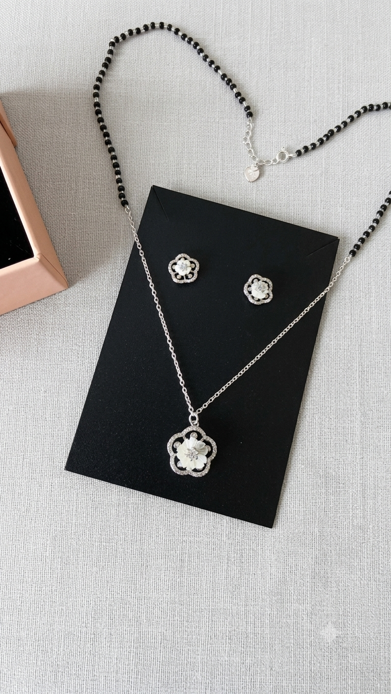 Silver Floral Modern Mangalsutra with matching earrings.