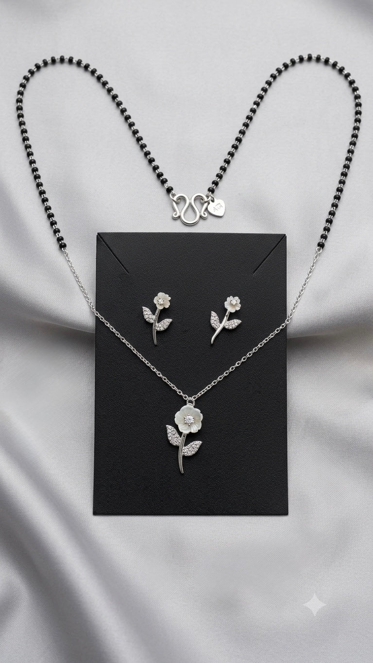 Silver Floral Modern Mangalsutra with matching earrings.