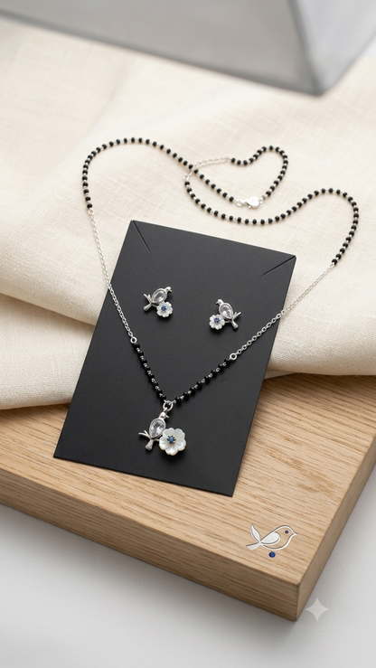 Silver Floral Modern Mangalsutra with matching earrings.
