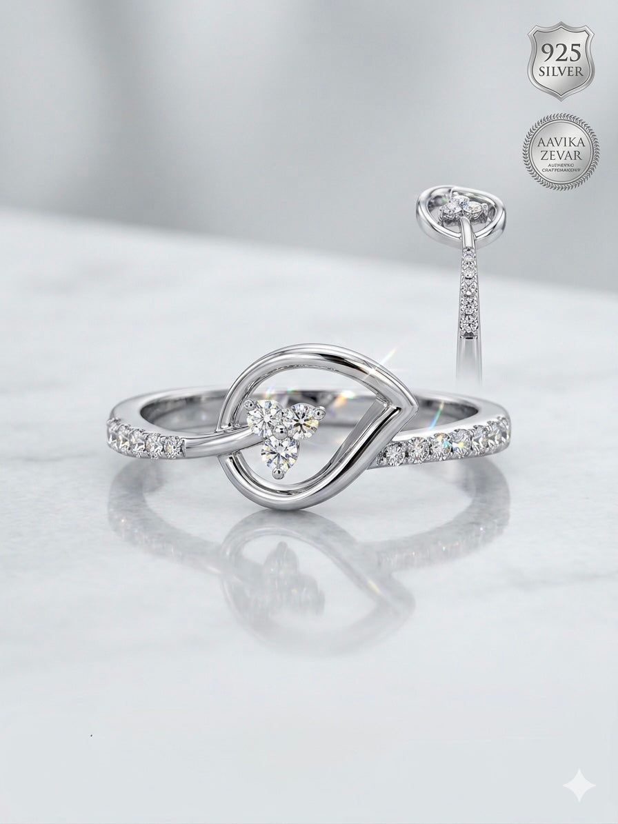 Infinite Grace: Sterling Silver Looped Knot Ring with Sparkling Diamond Accents