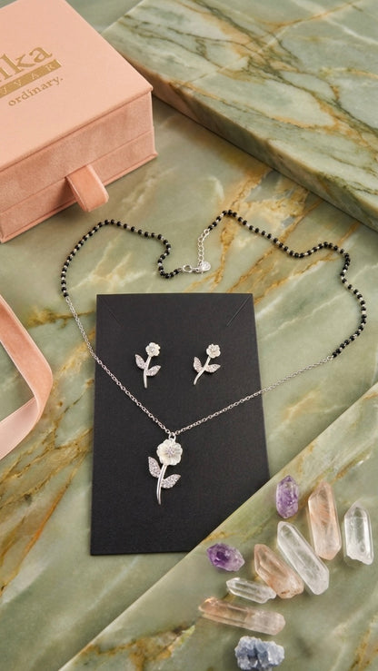 Silver Floral Modern Mangalsutra with matching earrings.