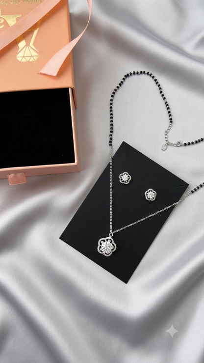Silver Floral Modern Mangalsutra with matching earrings.