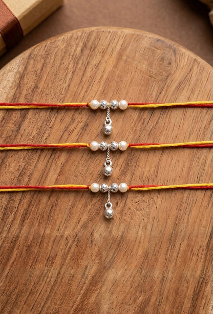 Elegant Pearl and Silver Bead Lumba Bhabhi Rakhi ( set of 3 )