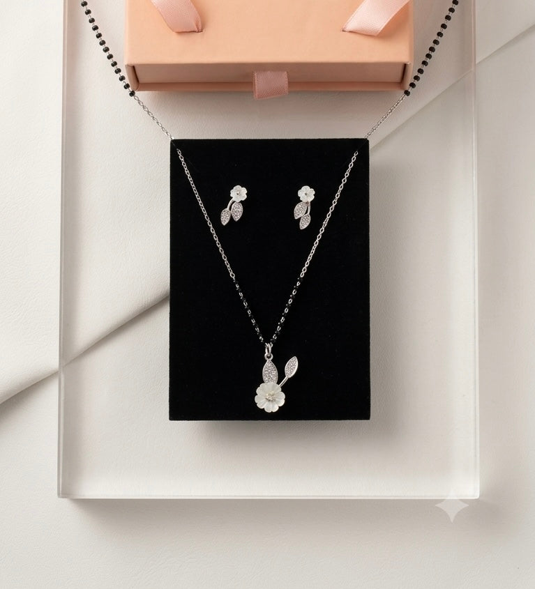 Silver Floral Modern Mangalsutra with matching earrings.