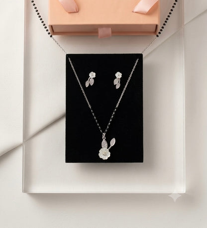 Silver Floral Modern Mangalsutra with matching earrings.