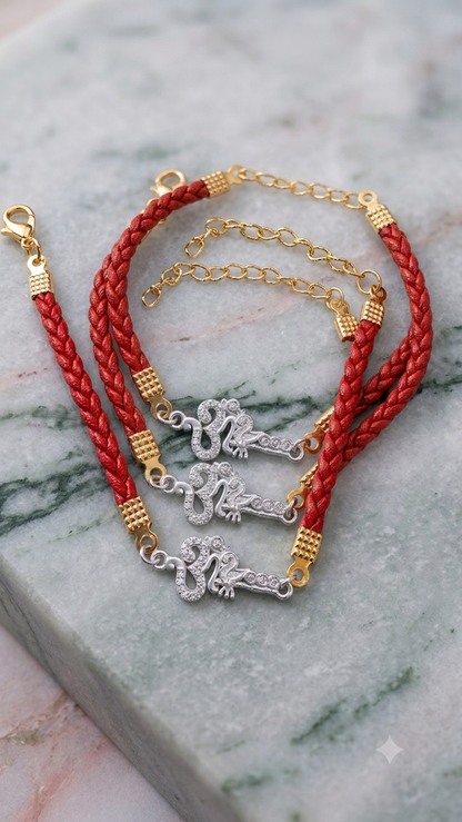 Silver & CZ "Om" Red Braided Leatherette Rakhi (set of 2)