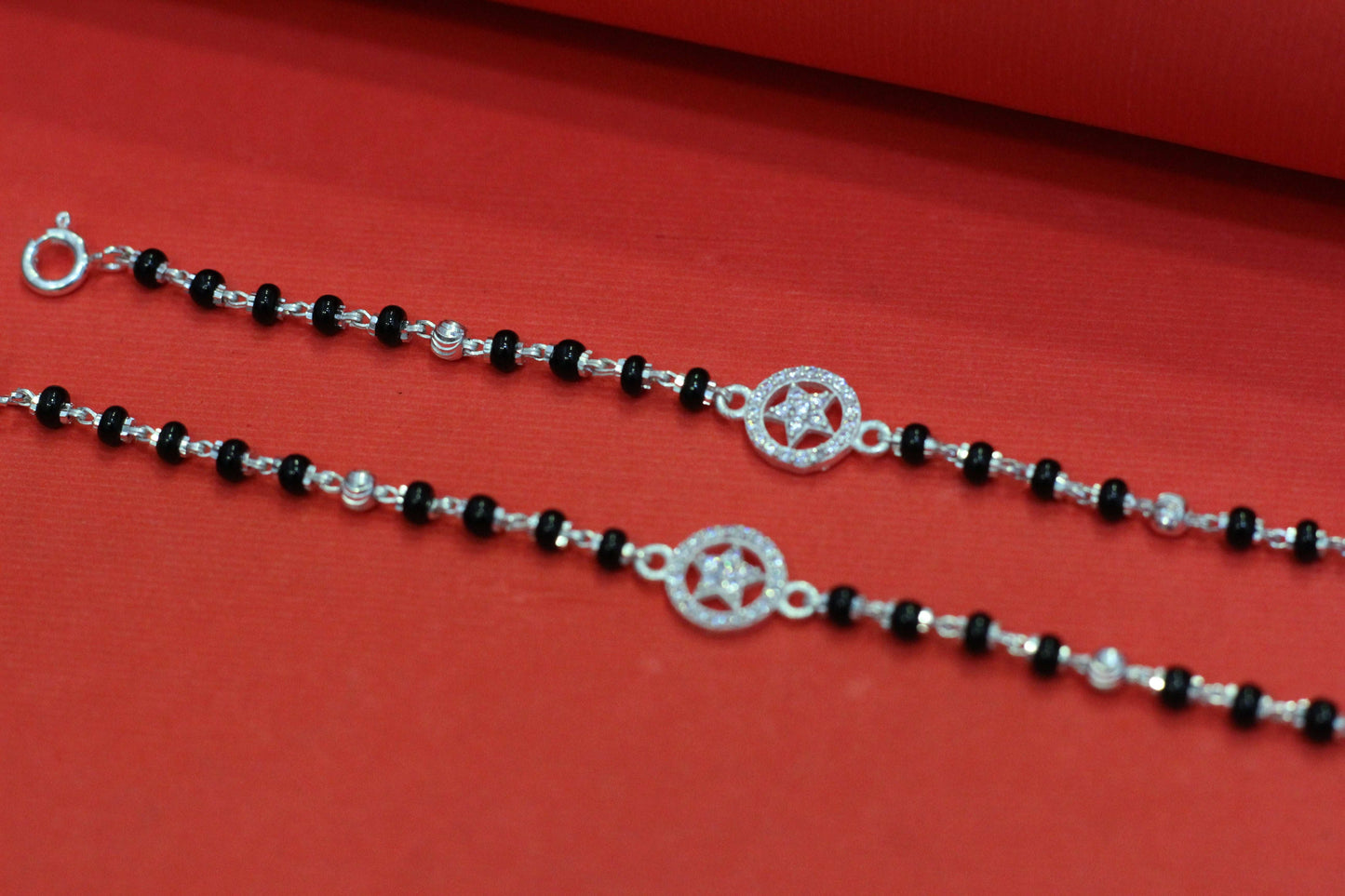 Silver nazariya with star symbol in round shape charm