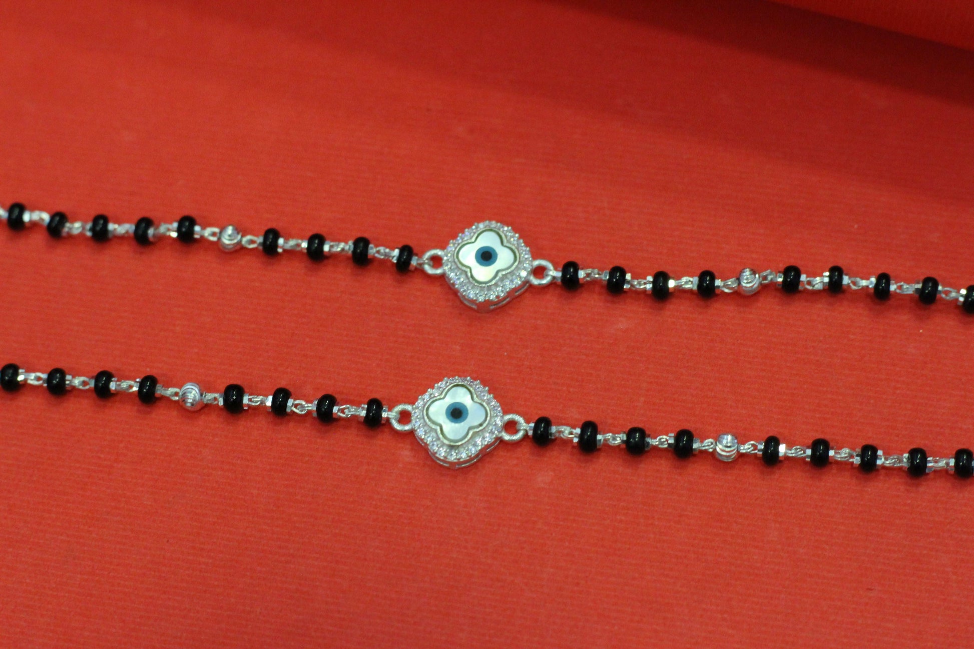 Silver nazariya with floral evil-eye centerpiece