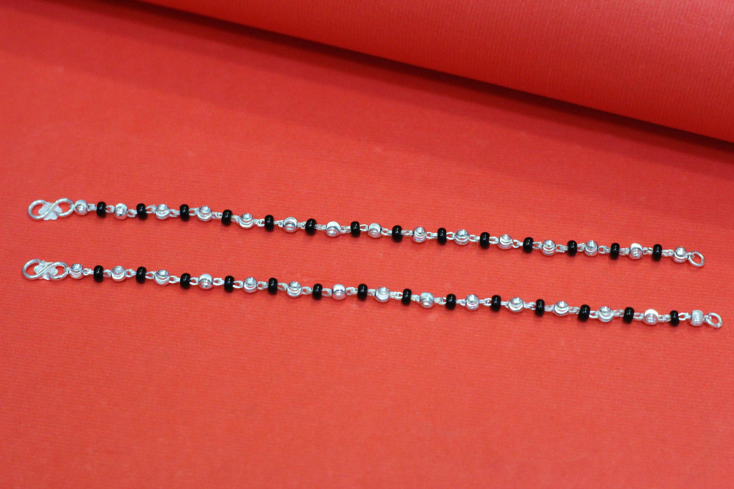 Silver nazariya one black beed and one silver ball