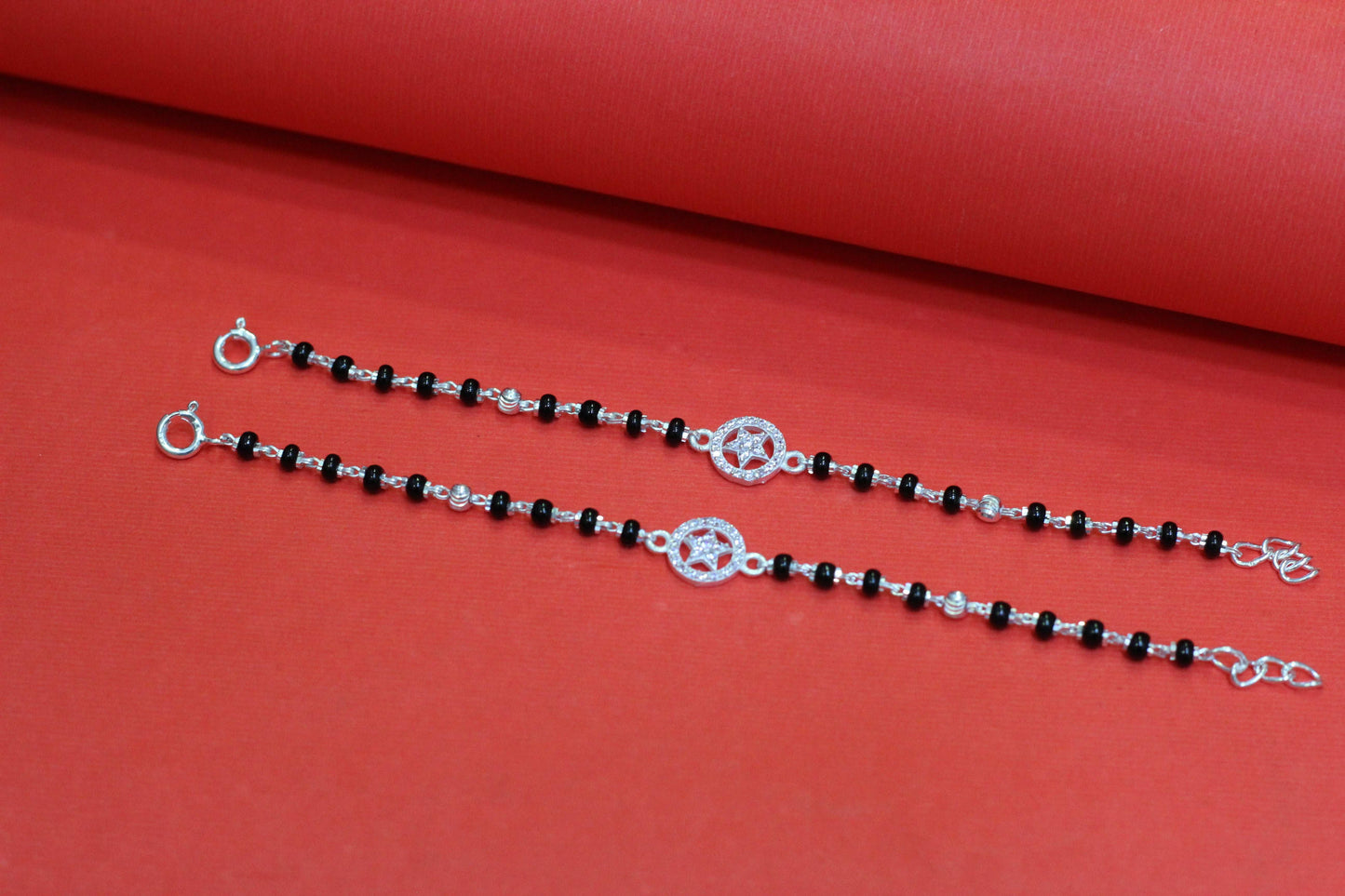 Silver nazariya with star symbol in round shape charm
