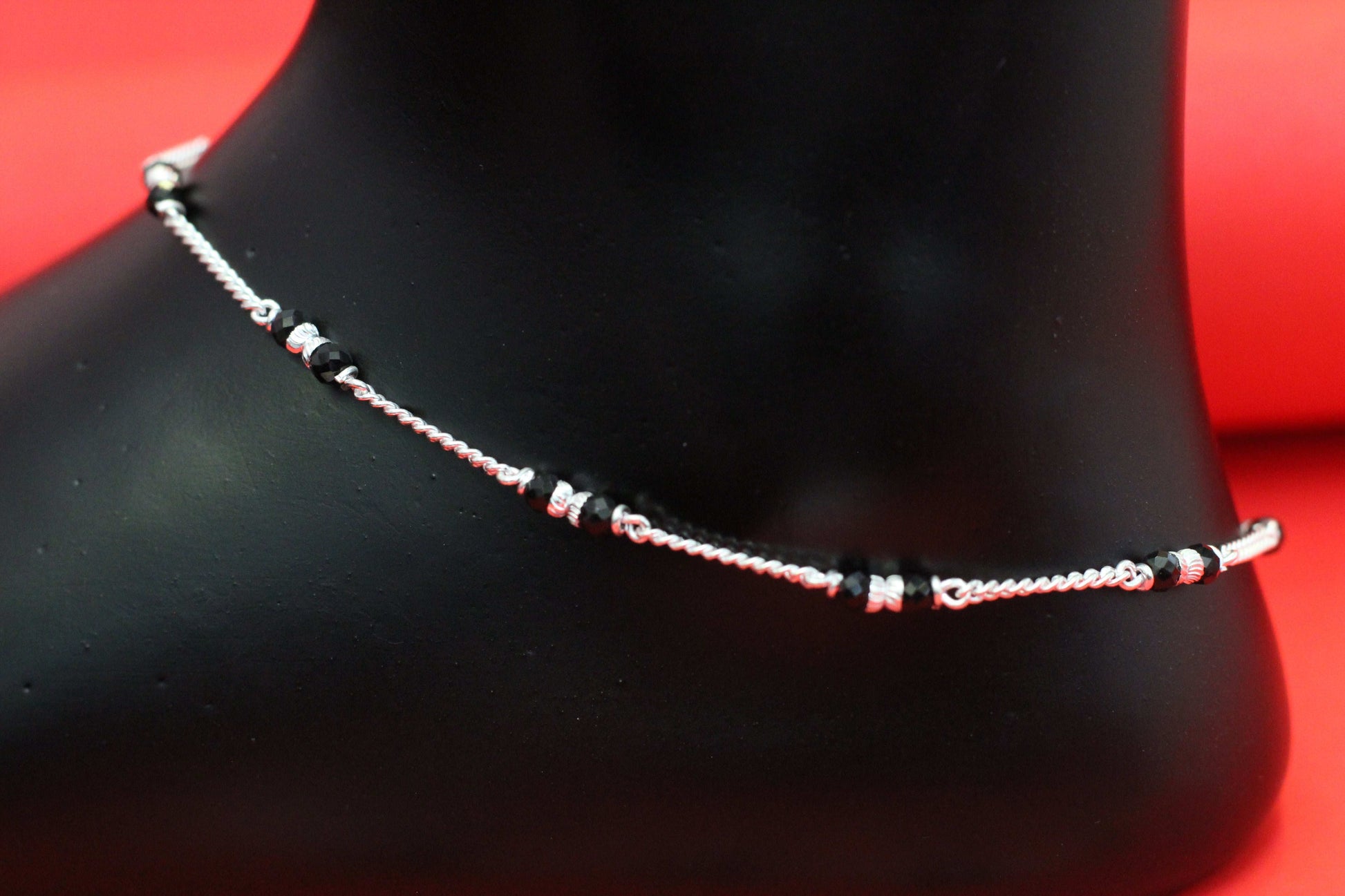 Elegant Silver Payal with Black Beads Design