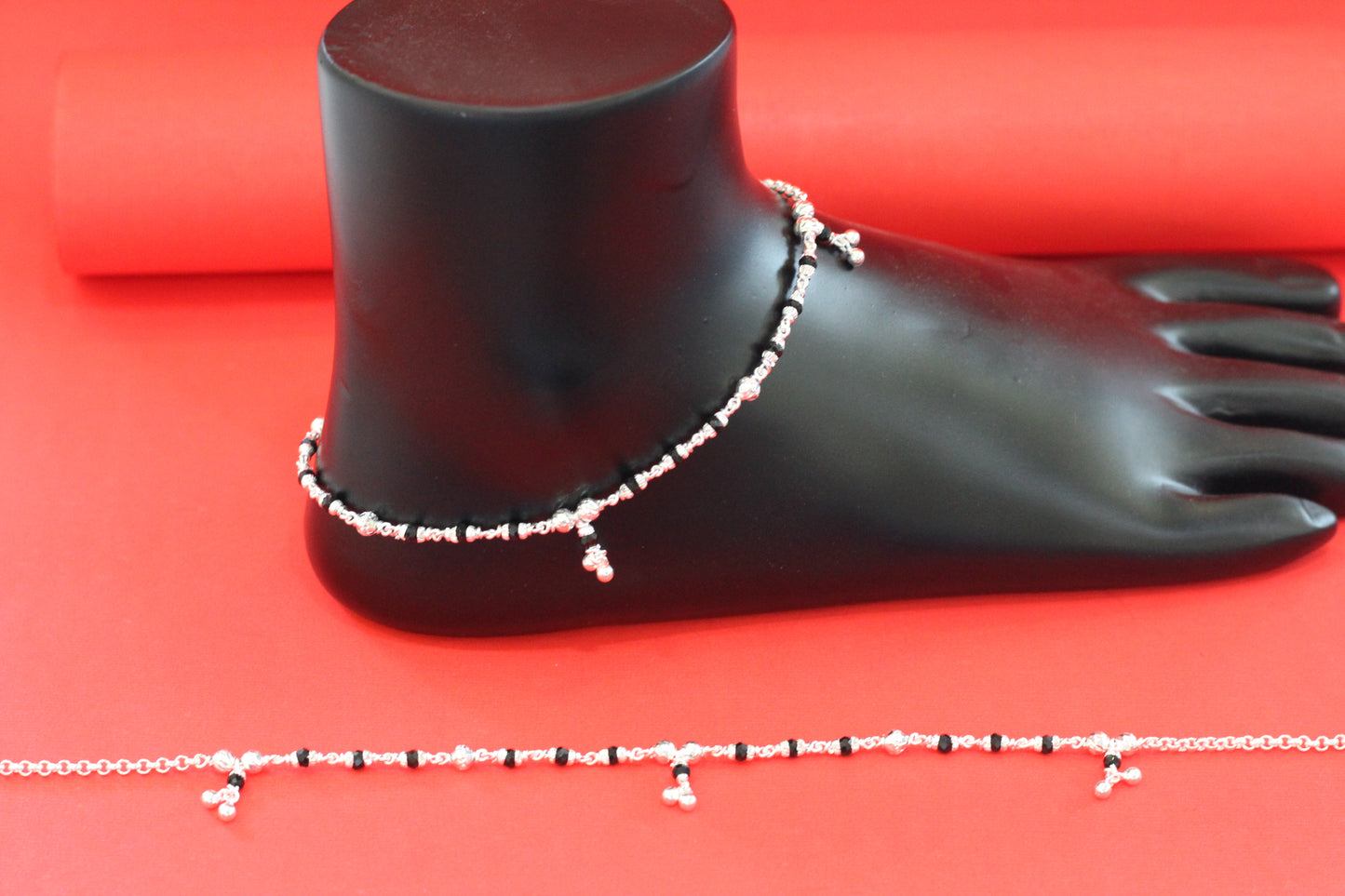 Lightweight silver anklet with small dangling beads for a graceful look