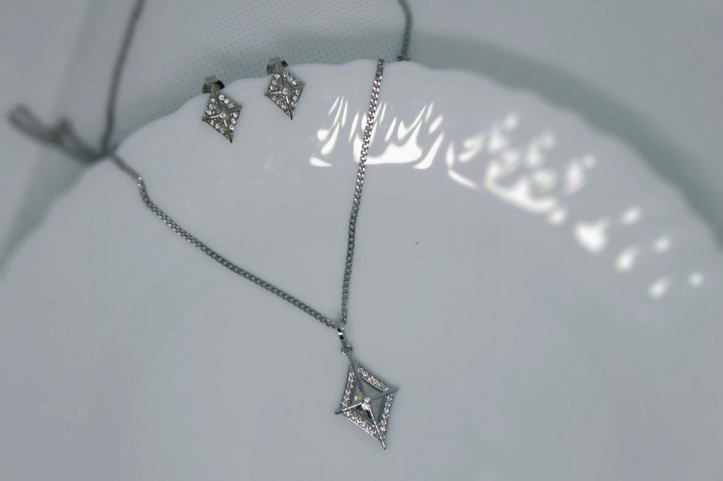 Silver chain with pendant and earrings